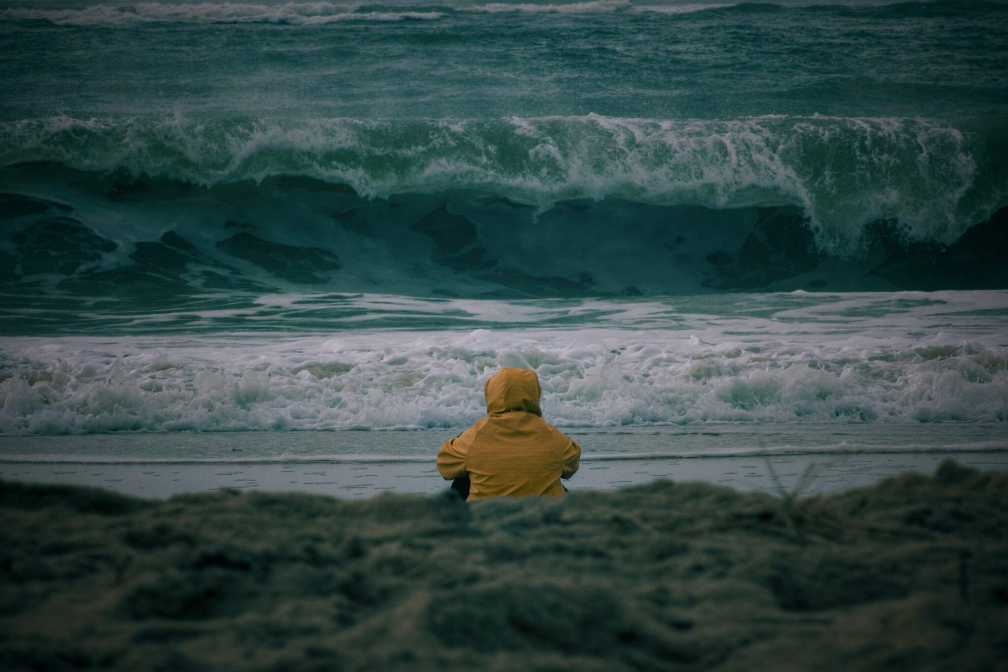 Person looking out at the ocean waves