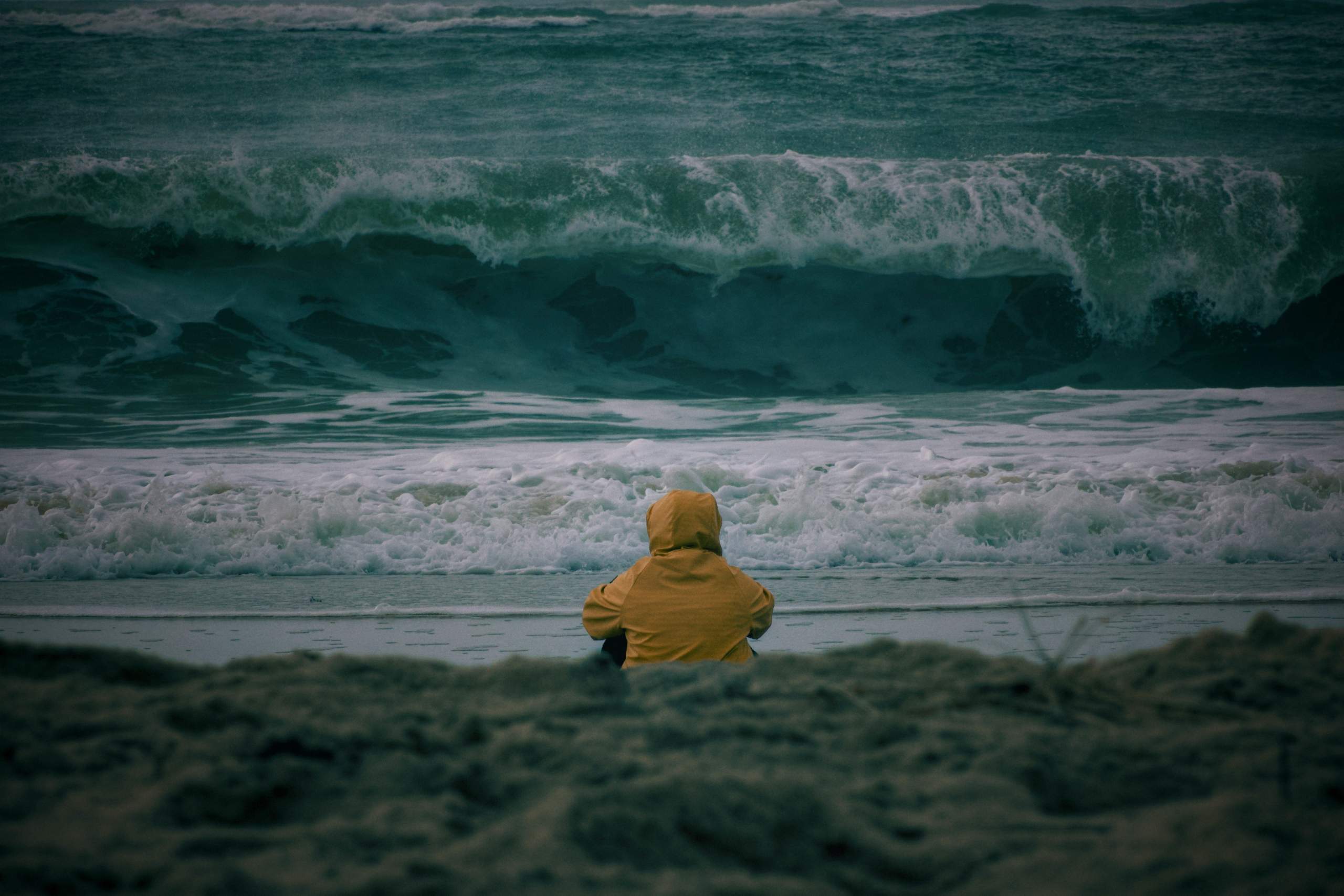 Person looking out at the ocean waves