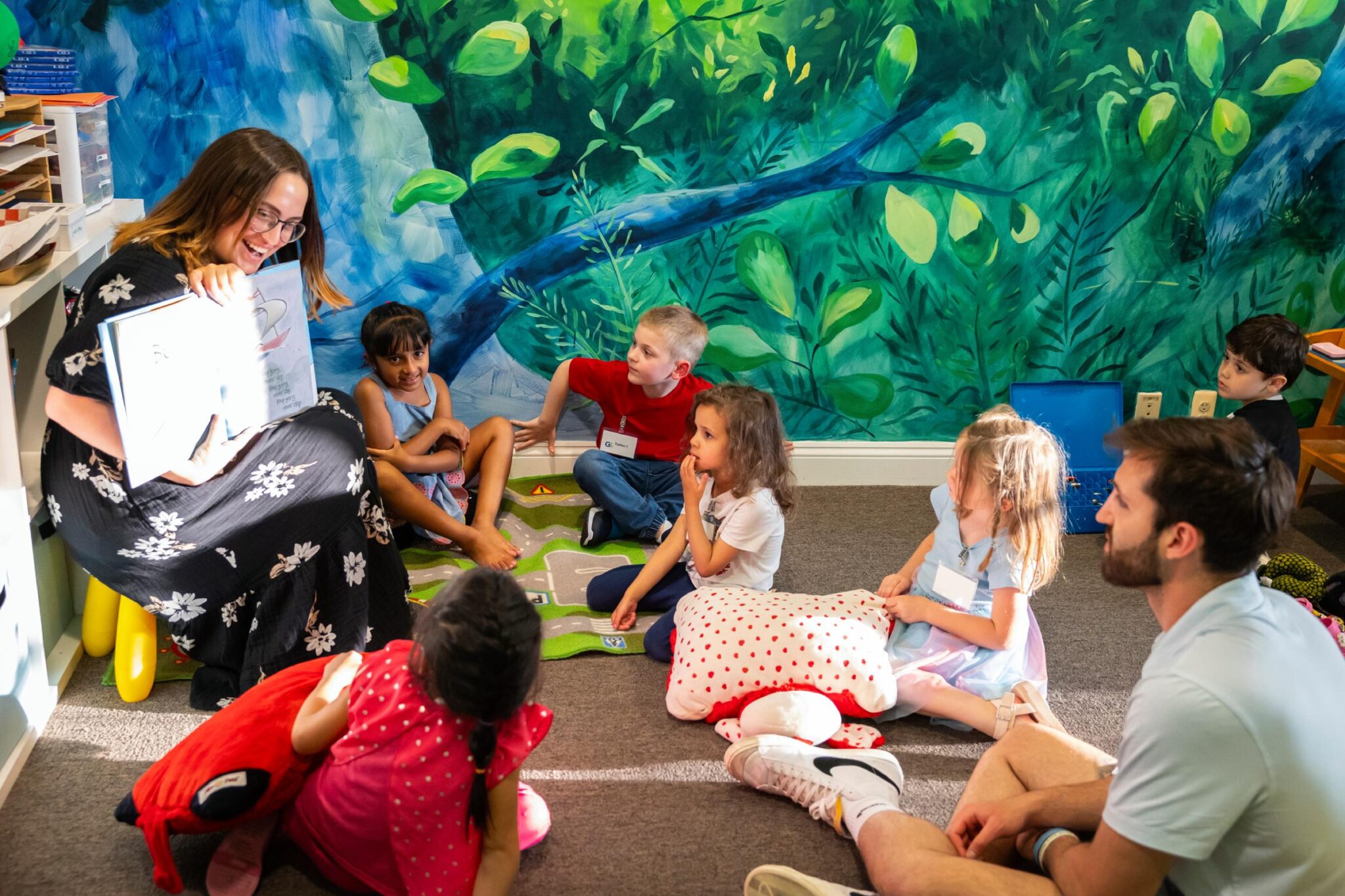 Woman reading to children